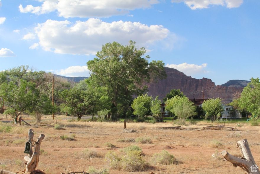 PRICE DROP! HOME ON TORREY'S CENTER STREET!! Two bedroom, two bath home on Torrey's Center Street. Pretty Torrey views in every direction and within walking distance of the store, shops and eateries. The north facing deck is cool and pleasant with spectacular views. A one car attached garage is conveniently accessed straight from the kitchen. The home sits on one-half acre with an assortment of fruit trees and a fenced garden area. Some recent updates to the home have added to the appeal and the home is now ready for occupancy.