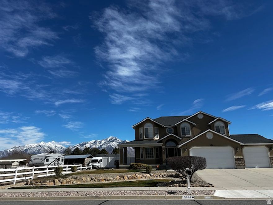 Rare Riverton property offering over half an acre with horse property rights (up to three horses), secondary water irrigation, a back garage/shop, RV hookups with 50 amp, and space for projects, animals, or recreational vehicles - a combination that is increasingly difficult to find inside the city.  This west-facing home has incredible mountain views in both directions and sits on a spacious lot featuring a large fenced backyard for everyday living and a separate pasture area. Both the backyard and pasture are supported by irrigation through the secondary water system.  Built in 1999 and consistently maintained, the home offers solid mechanical updates, neutral finishes, and practical everyday features including an upstairs laundry located near the bedrooms for convenience.  Property features include:   2525 powered garage/shop with 50-amp service (built in 2017)  1212 powered storage shed  RV parking with hookups  Unfinished basement with natural light and expansion potential  No HOA restrictions  Outdoor improvements include a newly installed sprinkler system and new sod in the backyard (2024). Irrigation piping has also been extended to the pasture area so the land can be watered using the secondary water system.  Major system updates include:   Roof replaced  2019  Full HVAC system  2021  Tankless water heater  2021  Dishwasher  2023  Hot tub  2023  Range  2024  Conveniently located near schools, shopping, and freeway access while still offering the space, flexibility, and outdoor lifestyle rarely found in newer developments.