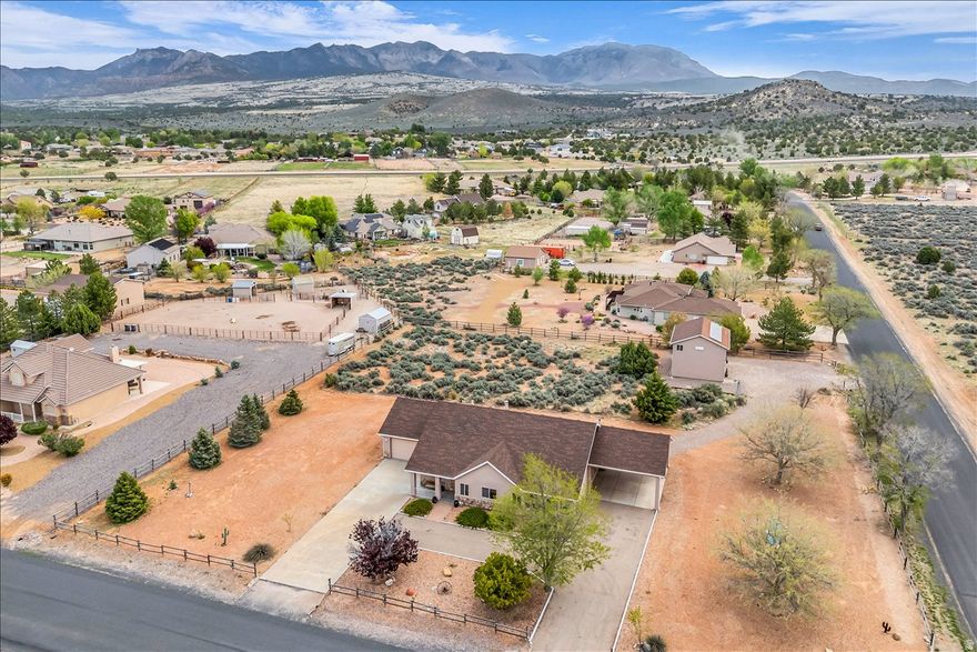 Experience the charm of country living on this spacious 1.21 acre horse property in Dammeron Valley. The main home blends comfort and modern updates, offering 3 main bedrooms and two baths and formal dining room. A detached garage includes a fully equipped casita featuring a kitchen, living room, bedroom and bath, perfect for guests, extended family or rental potential. Plenty of room for all the toys with the main house offering a 2 car attached garage 2 vehicle carport with 110V electrical hookups ensuring plenty of parking/storage. Extra insulation in all walls plus 2X6. RV Parking with dump/septic available.