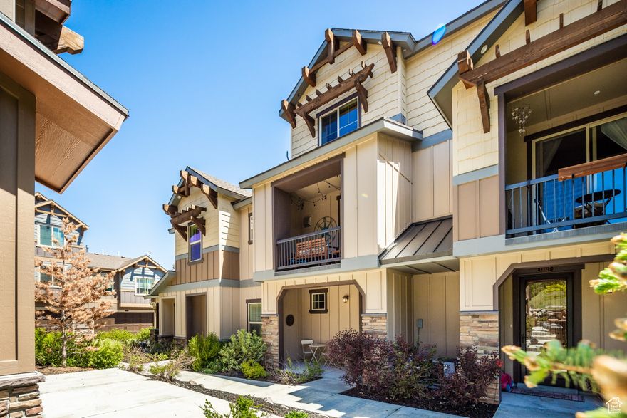 Tucked within the scenic Park's Edge community, this beautifully appointed townhome offers unbeatable access to Park City, Heber City, Midway, Kimball Junction, and the Uinta Mountains, placing you at the center of year-round adventure.  With over 1,600 square feet of thoughtfully designed living space and a great floor plan, the home features three bedrooms, three bathrooms, and abundant storage. The kitchen boasts stainless steel appliances, rich wood cabinetry, elegant granite countertops, and a convenient kitchen pantry. The welcoming living area centers around a striking stone fireplace, perfect for relaxing after a day outdoors, while large glass doors open to a private deck for enjoying fresh mountain air and tranquil views. The entryway includes a coat closet, and a laundry closet with washer and dryer is also included. New carpet has been added throughout for a fresh, updated feel.  The primary suite impresses with two generous walk-in closets and a spa-like ensuite bath. A two-car tandem garage provides plenty of room for recreational gear, while community amenities elevate the lifestyle with a 14-acre park, clubhouse with pool and hot tub, fitness center, and direct access to miles of scenic trails. Move-in ready and brimming with charm, this home captures the essence of elevated mountain living.