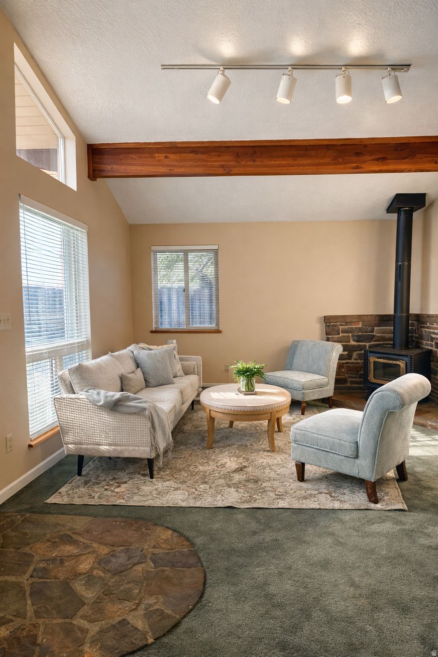 Welcome to this charming 3-bedroom, 2-bath brick rambler nestled in the heart of Centerville-a community loved for its peaceful neighborhoods, excellent schools, and unbeatable access to both Salt Lake City and the mountains. Inside, you'll find vaulted ceilings that create a spacious, airy feel, and a cozy wood-burning stove perfect for chilly evenings. The home also features two storage sheds, a  convenient carport, brand-new toilets, and a water heater replaced in 2016. Enjoy the benefits of both culinary and secondary water on the property. This home blends comfort, convenience, and location-all in a city you'll love to call home!