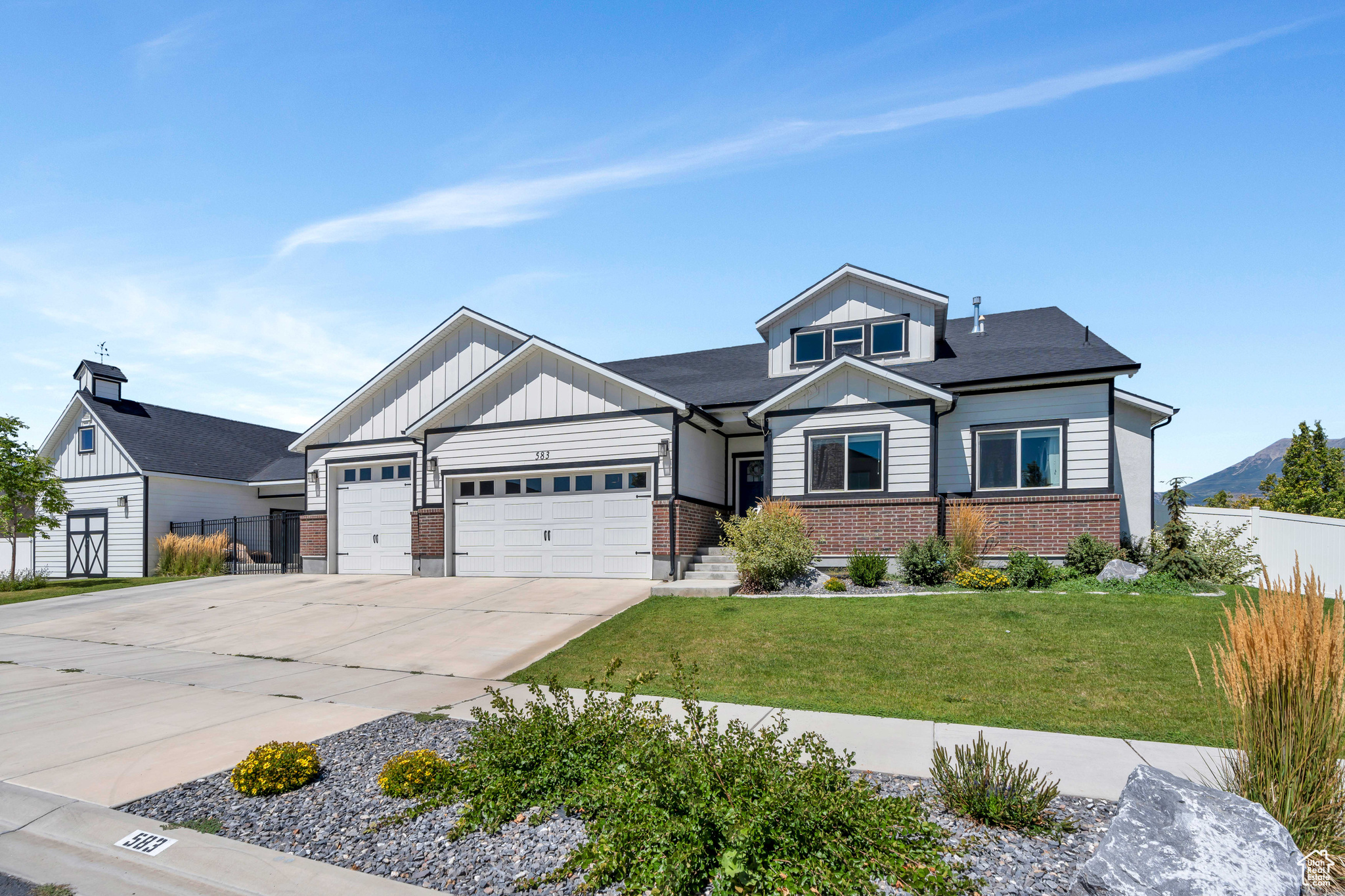 This freshly painted two-story home was built in 2016, is located in the vibrant community of Vineyard, Utah. Spanning over 6,000 square feet, it offers seven spacious bedrooms and five full bathrooms, providing comfort and space for a large family or guests. The four-car garage ensures ample room for vehicles and additional storage or a home gym. The backyard is designed for entertainment and relaxation, featuring a large fire pit, an inviting outdoor entertaining space, and a basketball court for sports enthusiasts. A trampoline and swing set make it a haven for all, while the vegetable garden boxes allow you to grow your own fresh produce this upcoming Summer. With RV parking available, this home is perfect for those with a love for adventure or need the space for a home business. Inside, the home boasts abundant storage and a large unfinished room, offering endless possibilities. Whether you dream of creating a serene yoga studio or a dynamic sports training room, this space is ready to be tailored to your needs. Located in a prime area, this home is surrounded by shopping and dining options, ensuring convenience at every turn. A local park is less than a block away offering a great place for outdoor activities, while jogging trails along Utah Lake provide easy access to water sports and stunning views plus the elementary school is kitty corner across the street. This property combines luxury living with the benefits of a thriving community, offering the best of both worlds.
