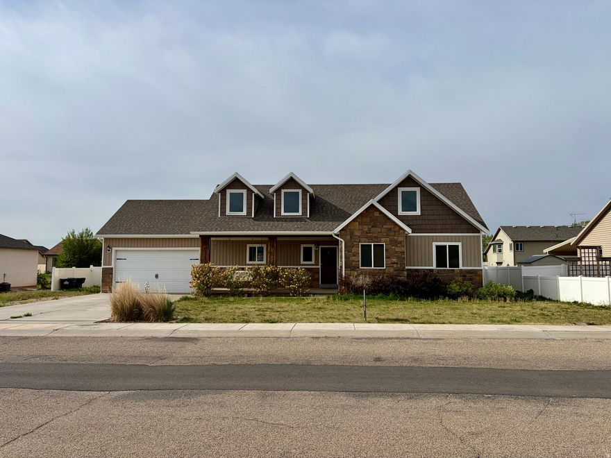 Beautiful, stunning home in Roosevelt, Ut. This home offers 5 bedrooms, 3 full bathrooms, open floor plan, lots of natural light, and plenty of room for entertaining.  The home also includes hot tub, washer, dryer, range, refrigerator and microwave. Main level features everything you would need for single level living; Kitchen, master bedroom, laundry room and comfortable living room as well as 2 additional bedrooms and a full bathroom. Upstairs you will find 2 more bedrooms, full bathroom, and 2 additional living/ entertainment spaces. Outside, this property features a fully fenced oversized back yard, RV parking, 2 car garage, automatic sprinkles & drip system, and of course a hot tub. This dreamy oasis could be yours. With ample parking space, a nice quiet neighborhood, and beautiful landscaping what more could you ask for. Make an appointment to come see this property today. Square footage figures are provided from county records. Buyer & Agent to verify all listing information.
