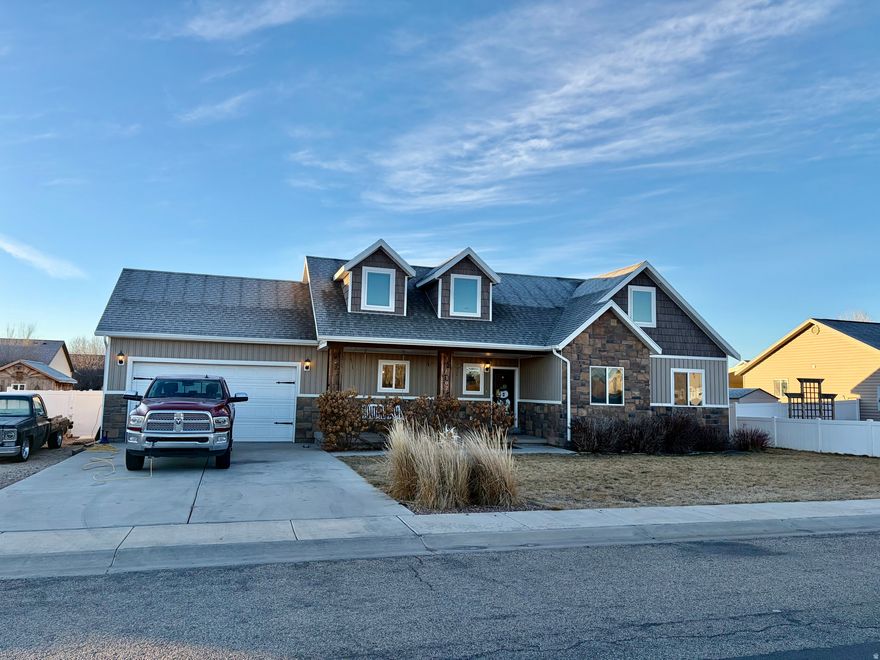 Beautiful, stunning home in Roosevelt, Ut. This home offers 5 bedrooms, 3 full bathrooms, open floor plan, lots of natural light, and plenty of room for entertaining.  The home also includes hot tub, washer, dryer, range, refrigerator and microwave. Main level features everything you would need for single level living; Kitchen, master bedroom, laundry room and comfortable living room as well as 2 additional bedrooms and a full bathroom. Upstairs you will find 2 more bedrooms, full bathroom, and 2 additional living/ entertainment spaces. Outside, this property features a fully fenced oversized back yard, RV parking, 2 car garage, automatic sprinkles & drip system, and of course a hot tub. This dreamy oasis could be yours. With ample parking space, a nice quiet neighborhood, and beautiful landscaping what more could you ask for. Make an appointment to come see this property today. Square footage figures are provided from county records. Buyer & Agent to verify all listing information.