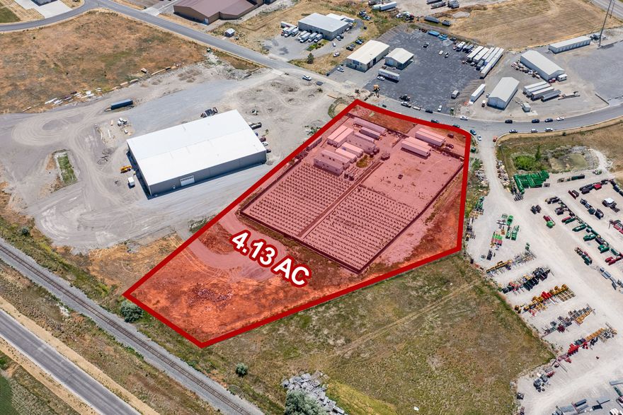 This 4.13-acre industrial land parcel in Corinne, Utah offers an excellent owner/user or investment opportunity ideally positioned near Highway 83 with quick access to I-15 for a wide range of commercial and industrial uses.   The owner is also willing to lease back 2.98 acres of the land, while the remaining 1.15 acres provides additional value-add potential for income or future development.  The property features flat, build-ready terrain suitable for warehouses, distribution, storage, manufacturing, equipment yards, and automotive services, supported by Corinne's continued growth, affordability, and strong workforce access.  All utilities are stubbed to the site, and a short-line railroad runs along the back of the property, with the potential for a rail spur subject to city approval.
