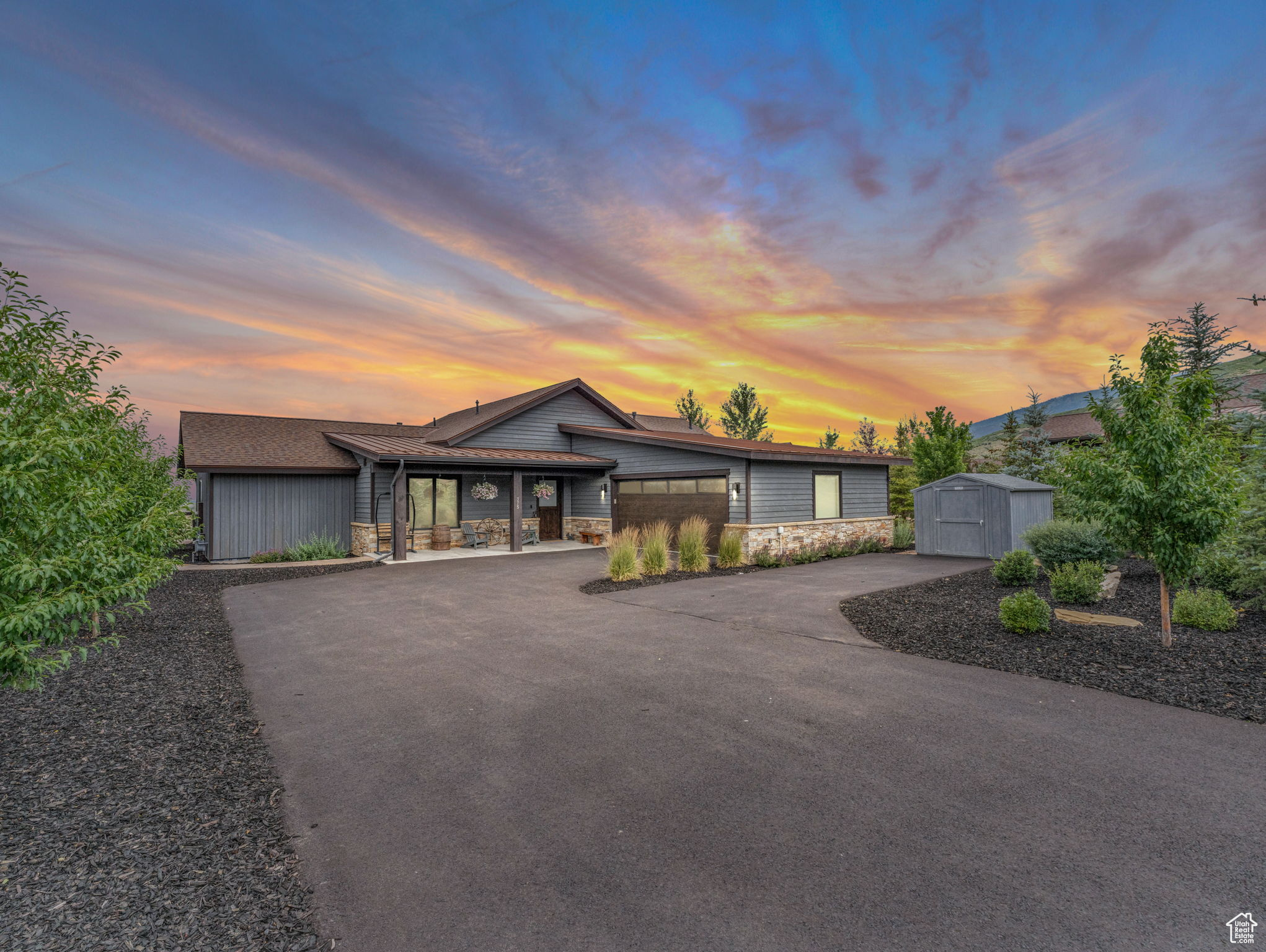 Beautifully landscaped single-level Gateway Rambler located in the desirable Thorn Creek neighborhood at High Star Ranch. Set along a wide open field with expansive mountain and ski views-including views of the newly expanded Deer Valley East Village-this home offers privacy, space, and year-round beauty. With approximately 2,059 square feet, the open-concept layout features durable luxury vinyl plank flooring, a sleek modern fireplace, Bosch appliances, quartz countertops, and custom cabinetry. The spacious, private primary suite opens directly to the patio and hot tub. Additional spaces include an en-suite office or bedroom, guest suite, laundry room, and pantry. The fully fenced backyard includes a flat lawn, open space views, an extended patio with hot tub, and custom paver walkways. A few spruce trees add privacy and greenery in the back, while a grove of mature spruce trees in the front yard enhances both curb appeal and seclusion. Additional highlights include a garage heater, dog wash station, premium garage flooring, Tuff Shed, and an added parking pad in front of the shed. Interior upgrades include blackout electric blinds in two bedrooms, electric blinds throughout much of the home, five outdoor cameras including a Ring doorbell, sump pump, French drains, secondary heat tape on the roof, and a full-yard sprinkler system. An air purifier and second filtration system were added to the furnace. The home was restained in 2023, and the driveway was freshly resurfaced in 2025. Located just 15 minutes from Park City, High Star Ranch offers 1,200 acres of year-round recreation with access to the Uinta National Forest, 30+ miles of private trails, a community pool, clubhouse, pickleball courts, bocce ball, horseshoe area, and equestrian amenities.