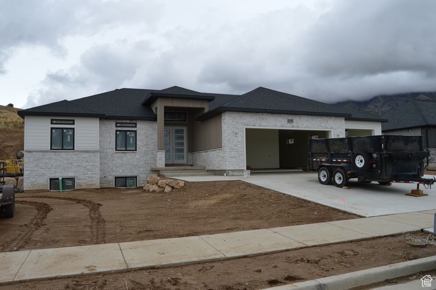 An incredibly beautiful home with amazing views.  Located in a quiet new subdivision.  Custom cabinets and quartz countertops, upgrades through-out. Walkout basement in garage.  2 bedrooms and a full bath finished in basement.  50% of basement is finished.  The unfinished half could be turned into a mother in law space.