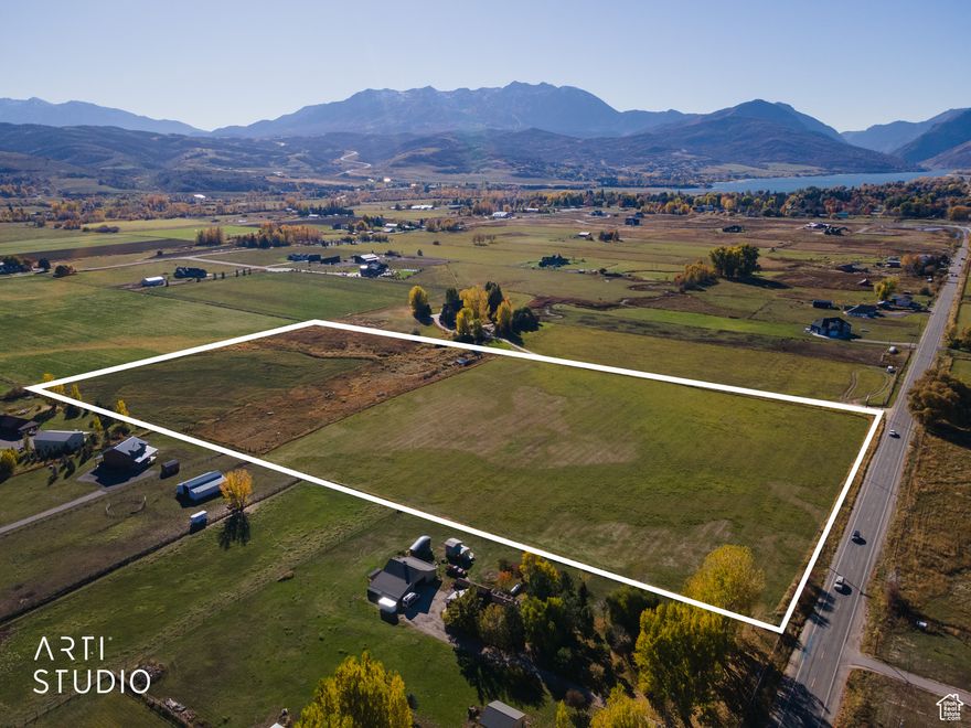 Experience the rare opportunity to own 18.38 acres in the heart of the Ogden Valley, offering commanding panoramic views of Snowbasin Ski Resort and the surrounding valley. This remarkable property provides the ideal setting for a private luxury estate or a multi-lot development opportunity with the potential for 5+ building lots (buyer to verify). Enjoy the perfect balance of privacy and accessibility-just minutes from three world-class ski resorts-Snowbasin, Powder Mountain, and Nordic Valley-as well as Pineview Reservoir for boating and summer recreation. The land features flat, usable terrain, 14 Huntsville Irrigation water shares, and easy access to nearby mountain biking, hiking, and groomed cross-country ski trails. Includes parcel numbers: 21-026-0010 and 21-026-0011. As is customary for this part of the Ogden Valley, a well will be required for culinary water. Located only 50 minutes from Salt Lake City International Airport, this property combines mountain serenity with urban convenience. Whether you envision an expansive private retreat or an exclusive enclave of custom homes, this rare acreage offers limitless potential in one of Utah's most desirable mountain communities.
