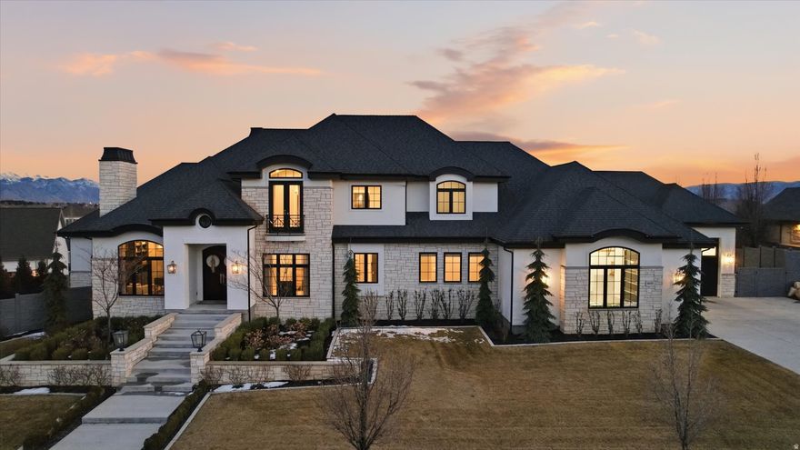 **OPEN HOUSE Saturday, April 18th | 1:003:00 PM**   An extraordinary opportunity to own one of Highland's most impressive luxury estates, ideally located in the prestigious Country French Estates-widely recognized as one of Utah's most sought-after luxury communities.  This exceptional custom residence by Highland Custom Homes offers over 10,000 square feet, 7 bedrooms, and 6.5 bathrooms, thoughtfully designed to blend timeless architecture, refined craftsmanship, and elevated modern living.  Inside, soaring ceilings, expansive windows, and beautifully curated finishes create a warm yet sophisticated atmosphere. Ten-foot ceilings on the main level and basement, along with nine-foot ceilings upstairs, enhance the home's open, grand feel.  The gourmet kitchen is designed to impress-featuring a stunning marble island, quartz perimeter countertops, custom cabinetry, premium Thermador appliances, and a highly functional Costco door for effortless everyday living.  The home offers two luxurious main-level primary suites, spacious secondary bedrooms with walk-in closets, and laundry rooms on every level. The primary suite is a true retreat, complete with heated marble floors, dual shower heads, and spa-inspired finishes.  The fully finished basement with 10-foot ceilings is ideal for entertaining, highlighted by dramatic folding glass doors that open seamlessly to the backyard. The space also offers flexibility for a mother-in-law suite, nanny quarters, or future ADU.  Modern comfort and efficiency are elevated with three HVAC systems creating 12 climate zones, whole-home humidifiers and water softeners, integrated audio, remote-controlled fireplaces, and motorized blinds and drapes.  Step outside to your private resort-style backyard featuring a heated pool and spa, a covered deck with gas hookups for outdoor dining, permanent EverLights exterior lighting, and additional power for custom lighting and entertaining.  The heated and insulated garage includes extra-wide and deep bays along with 30-foot RV parking. Additional highlights include heated floors in the mudroom and primary bath, a dedicated dog wash room, and elegant marble and stone finishes throughout.  Many furnishings and appliances are included, offering a rare turnkey luxury opportunity.  Join us at the Open House or schedule your private showing today-homes of this caliber and location rarely become available.  Square footage provided from recent appraisal; buyer to verify all info.