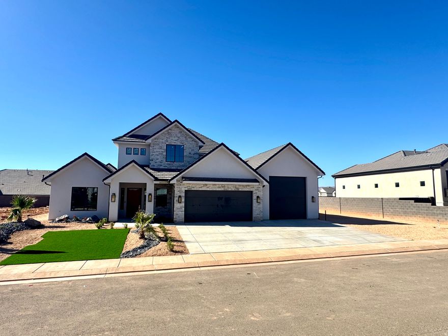 Under Construction. Completion Mid November 2025.   New build by Novelty Homes in the Majestic Fields community near Crimson High School. This 5-bed, 3.5-bath home features a spacious open layout with a 60-inch fridge/freezer, upgraded cooktop/oven, and a $25,000 distributed audio system. Clean, modern finishes and ample storage throughout. Photos of the same floor plan. Fully landscaped and move-in ready September 2025. Located within walking distance of a world-class regional park under construction (opening Fall 2025). Minutes from Sand Hollow Golf Course, the reservoir, St. George Regional Airport, and close to Zion, Snow Canyon, Tuacahn, and more. Enjoy quality construction, a functional floor plan, and access to Southern Utah's top recreation and amenities.