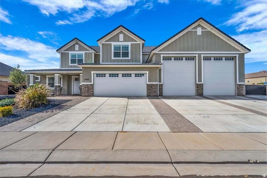 Bring all your toys! This exceptional home is designed to fit them all and then some, with over 2, 000 sq ft of garage space, including a double RV garage measuring approximately 51' deep and 44.5' deep, complete with HVAC, a bathroom, 220 power, an RV dump, and an additional 19' x 49' RV pad along the side of the home. Inside, you'll find a beautifully crafted, highly upgraded interior featuring elegant tile and granite finishes throughout, Thermador appliances, an electric oven paired with a gas range, and WiFi-enabled conveniences that elevate everyday living. The gourmet kitchen impresses with a spacious butler pantry, abundant cabinetry, including built-ins beneath the bar, and a seamless flow into the warm, inviting living area with a stylish fireplace. A thoughtfully designed mudroom, central vacuum system, and a large laundry room with granite, tile, and ample storage make organization effortless. The main level includes a dedicated office and a luxurious master suite, offering comfort and convenience all on one floor. Guests will love the private retreat upstairs, complete with three bedrooms, two bathrooms, and a beautifully appointed guest suite featuring a built-in Murphy bed, semi-kitchenette, and en-suite bath. Step outside to enjoy the built-in outdoor grill with a finished storage room, plus exterior 220 and an additional RV dump for ultimate flexibility. With the garage fully plumbed for an air system and storage at every turn, this home is the perfect blend of luxury, functionality, and unmatched space for every adventure. Pressure washer, phase converter in garage, garage refrigerator, and outdoor refrigerator excluded. Buyer to verify all information, deemed reliable, however buyer to verify all info including utilities, rental restrictions, and HOA information if applicable.