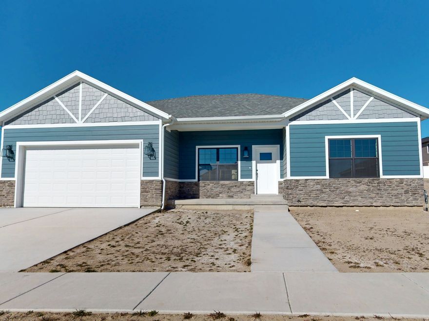 This modern new-construction home combines traditional charm with contemporary design, featuring a full basement and a sleek aesthetic highlighted by white, gray, and chrome fixtures. The interior offers three bedrooms, two bathrooms with double sinks, and a two-car garage. The chef's kitchen includes all-new G.E. stainless steel appliances, Corian countertops, and a farmhouse sink, along with a pantry, closet organizers, and a dedicated cabinet for your wastebasket. The master bedroom and dining room both open to a spacious back patio, ideal for outdoor entertaining. Additional features include plumbing for a water softener and garage outlets ready for electric vehicle charging, blending style, functionality, and modern convenience.