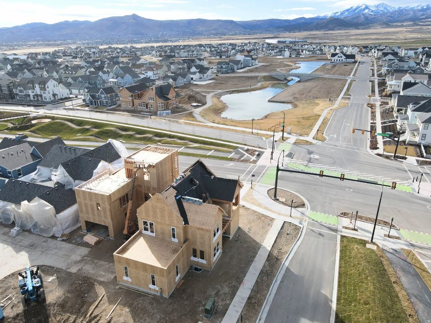 Brand New Corner Lot Home with a brand-new wood exterior option! Amazing views of the New Watercourse from the hot tub-ready balcony in this popular Adventurer floor plan! Price includes impressive designer upgrades such as: 9-foot ceilings on all levels, A fireplace, modern railing, coveted indoor/outdoor living layout with oversized sliding glass doors connecting the Great Room and Kitchen with outdoor patio space. The main-level office is filled with natural light thanks to abundant windows perfect for work or relaxation. Upstairs, the dreamy Primary Suite features its own covered, hot tub-ready balcony, along with a luxurious en-suite bathroom complete with a stand-alone soaking tub and a spacious walk-in shower. Estimated completion: Summer-Fall 2026. *Interior finished photos are of previously built homes of same floor plan for example purposes. Upgrades and finishes vary.*