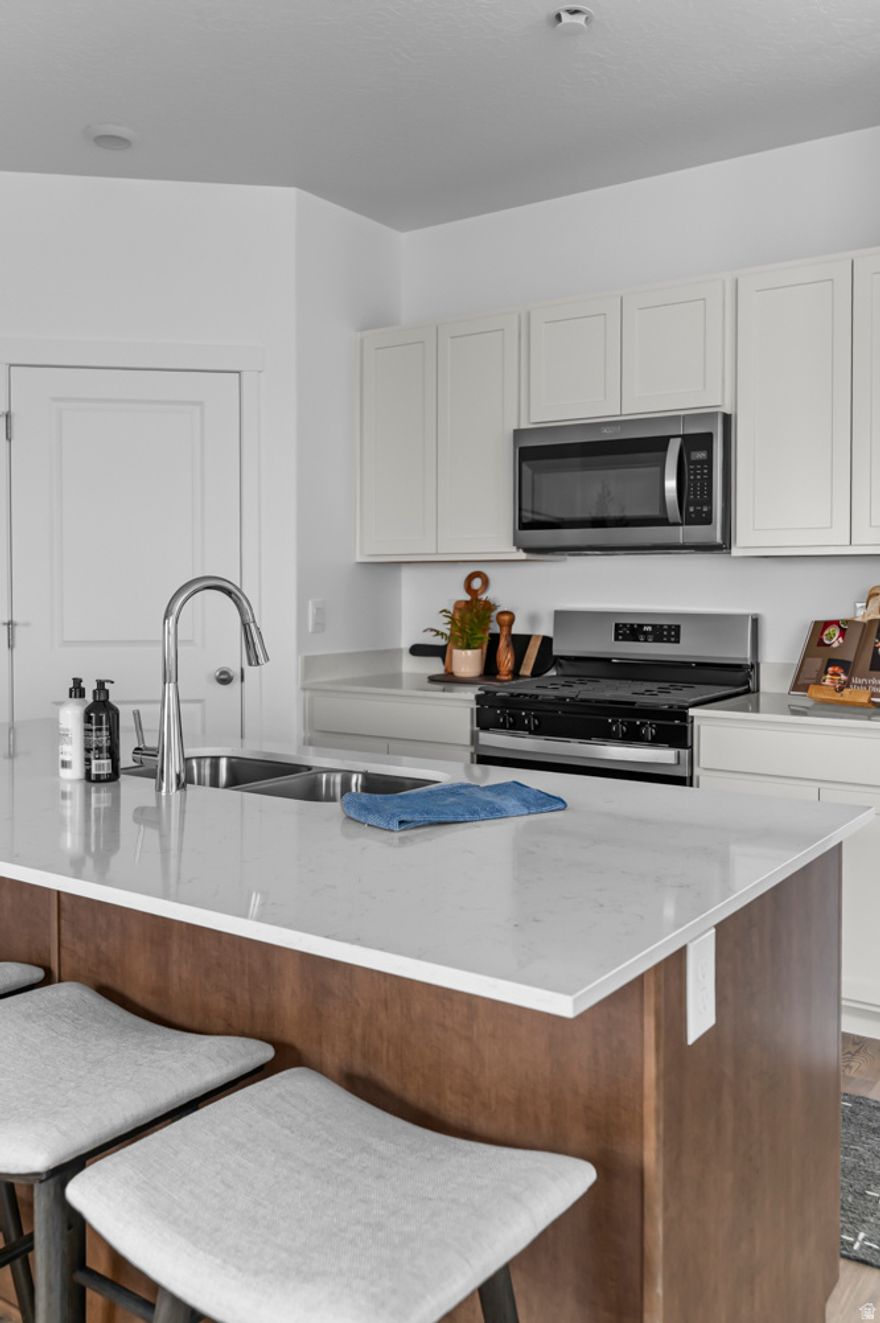 The Clover is a two-story home that offers 3 bedrooms, 2.5 bathrooms, a loft, and a 2-car garage with a functional and open main floor layout. Interior features include quartz countertops, laminate flooring, modern cabinetry, a walk-in pantry, and a convenient mud room off the garage. Upstairs includes a spacious loft, laundry room, full bath, and a large primary suite with walk-in closet and private bath. The home also includes a unfinished basement with space for future bedrooms, bath, and living area-plus a concrete back patio for enjoyment. Home comes with a Smart Home Package, radon system, and builder warranty. Actual home may differ in color/material/options. Pictures are of finished homes of the same floor plan and may contain options/upgrades/ decorations/ furnishings not available at the advertised price. No representation or warranties are made regarding school districts and assignments; conduct your own investigation regarding current/future school boundaries. Buyer to verify all information.