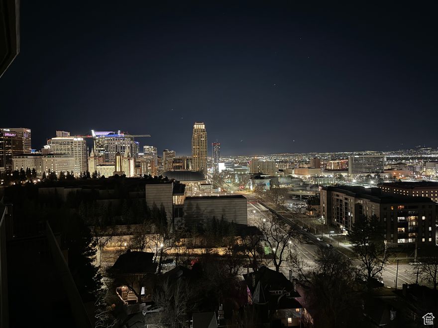 Welcome to your dream home in the heart of Salt Lake City! Top 9th floor unit in Capitol Hill, this rarely available 2-bedroom, 2- bath condo offers panoramic views and luxury finishes that set it apart from the rest. Step inside to find a completely remodeled residence featuring brand new hardwood floors, custom dovetail cabinetry, high-end designer tiles, and premium finishes throughout. The open-concept living area is flooded with natural light and flows seamlessly onto your private patio, where you'll enjoy breathtaking views of the Capitol building, beautifully illuminated at night. Both spacious bedrooms share a second patio, perfectly positioned for soaking in sweeping views of downtown Salt Lake City and the surrounding mountains. You'll love the convenience of two included parking spaces and an extra-large private storage space for all your adventure gear. Don't miss the opportunity to own a slice of Salt Lake City's best views in a turnkey, high-end condo!