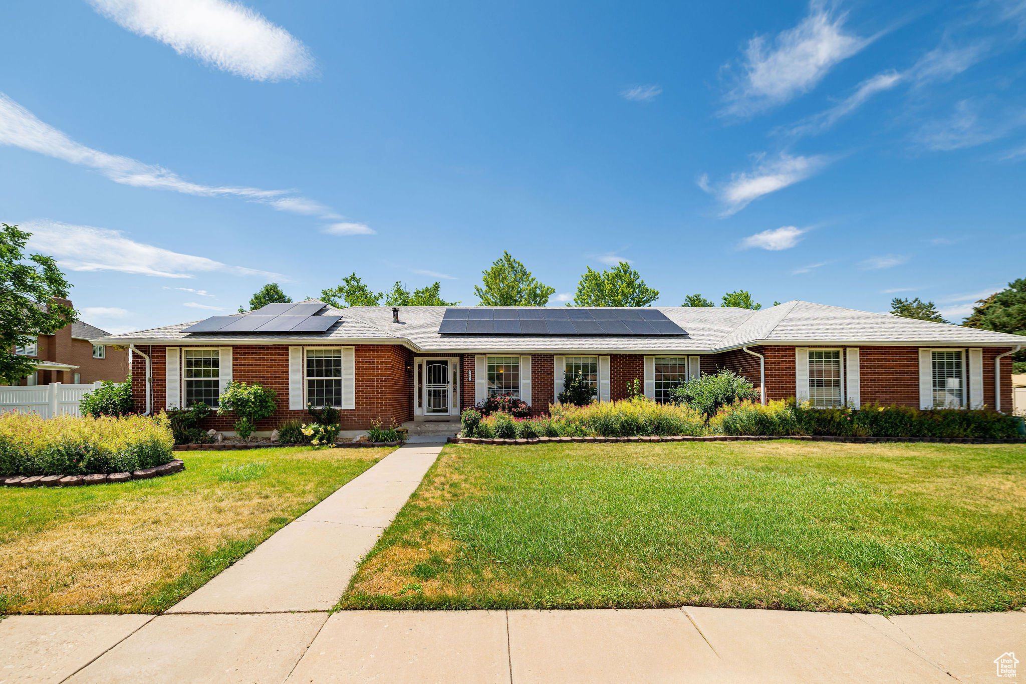 Located in the coveted Uintah Highlands neighborhood- where the homes have larger lots and are still close to all amenities and the mountains. Nearly half an acre with panoramic mountain views, mature fruit and nut trees, and a large garden create a fantastic space for anyone who loves the outdoors. Fully-owned solar panels mean energy savings year-round. A steel beamed shed provides storage for all of your tools and toys. The primary suite has a fireplace, and thoughtfully remodeled, spa inspired primary bath with dual shower heads. French doors in the primary lead directly the hot tub (included). A second full bathroom on the main floor is remodeled too. New carpet; New water heater and an HVAC system equipped with UV treatment and a whole home humidifier. Nestled on the boundary of Uintah and South Ogden, you're just minutes from downtown Ogden's shops and dining, Hill Air Force Base, and world class skiing, hiking, and biking in the Wasatch Mountains.