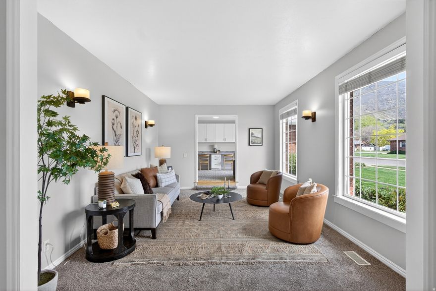 BACK ON THE MARKET WITH A NEW LOWER PRICE AND NEW CARPET! Set on a spacious half-acre lot, this property offers a rare blend of open living and expansive outdoor space. The main level features a connected kitchen, dining, and living area that flows comfortably for everyday living and gatherings.  The primary suite features a fireplace that adds warmth and character as well as a large, fully updated en-suite bath with a large shower and a walk-in closet. French doors from the primary bedroom provide direct access to a hot tub, creating a seamless indoor-outdoor connection. Two additional bedrooms, a second fully updated bathroom, a sitting room with amazing mountain views, and a large office space, which could be easily converted to a semi-formal dining room or game room round out the main floor.  The basement features two additional extra large bedrooms, a large rec room with a wood burning stove, and abundant storage.  The fully fenced backyard is designed for both function and enjoyment, with mature fruit and nut trees, a steel-frame work shed , dedicated garden space, and plenty of room to spread out. This home is perfect whether you love entertaining or enjoy having a private outdoor space.  The setting offers a more rural feel while remaining conveniently close to Ogden's amenities, and the year-round recreation of the Wasatch Mountains, including skiing, hiking, and biking. Additional highlights include fully paid solar, offering long-term energy efficiency and cost savings. A well-rounded property with space, updates, and access to both nature and city conveniences.