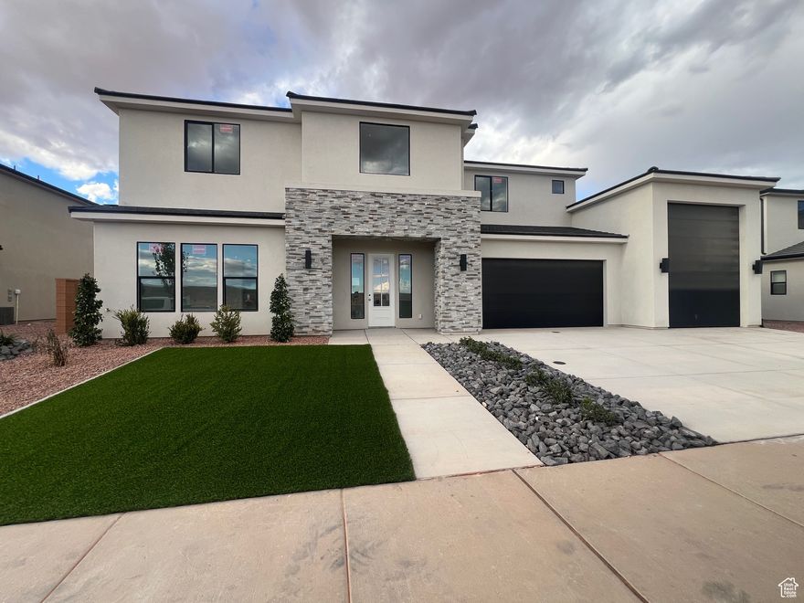 5 bedrooms, 4.5 bathrooms, corner lot, RV garage + additional RV parking space, primary suite with a gorgeous bathroom with double vanity, walk-in tiled shower, soaker tub and walk-in closet, additional ensuite on the main level, grandiose entryway with a beautiful staircase, large open great room, dining and kitchen with lots of windows looking out to the nice sized north facing backyard that has an empty canvas, block walls on 3 sides, quartz countertops, custom cabinets, stainless appliances including the refrigerator, tankless water heater, rain gutters, large loft that leads to a spacious covered balcony with great views, builder warranty and Dixie Power District. All information is deemed reliable but not guaranteed, buyer to verify all.