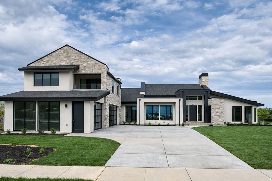 **LIMITED TIME OFFER: Up to $33,000 toward a 2-1 rate buy down when you use our preferred lender** This home features luxury finishes, expansive views, indooroutdoor living, an attached motherinlaw suite, formal office, and ensuite bedrooms. Designed for those who value open plans, vaulted ceilings, or quiet moments on the patio by the outdoor fireplace. Includes a home gym, private theater, 3 car garage, main floor master, and a bonus garage for storage or conversion to a golf simulator, batting cage, art studio, or larger gym. Luxury tile and millwork throughout lend sophistication, creating an inviting space to entertain and relax.