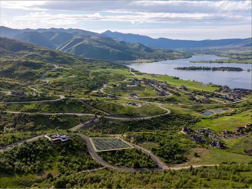 Discover the ideal setting for your dream mountain retreat with this premier lot in the gated Hawkins Creek community. Positioned to capture breathtaking views of Pineview Reservoir, Ogden Valley, and the striking peaks of Powder Mountain, Ben Lomond, and Lewis, this property offers endless opportunities for thoughtful design. The completed geotechnical study provides valuable preparation and cost savings, while the lot's border with open space enhances privacy and a sense of seclusion. Just off historic Old Snowbasin Road, the location places you minutes from Snowbasin Resort, Anderson Cove's boat dock, and a wealth of hiking, biking, and skiing trails. Hawkins Creek is surrounded by alpine meadows, oak forests, and preserved open spaces, with community covenants that protect migratory wildlife and Architectural Guidelines that ensure the natural setting remains intact. Within The Legends subdivision, you'll enjoy 160 acres of rolling hills, nearly 80 acres of dedicated open space, and a private trail system for hiking, biking, and equestrian use, complemented by additional public trails nearby. Offering the perfect blend of beauty, solitude, and convenience, this lot is an exceptional canvas for your future mountain hideaway. All property information, boundaries, and documents to be verified by buyer.