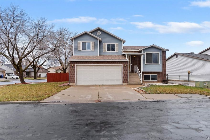 ASSUMABLE VA loan available at 5.625%, subject to lender approval. This move-in ready, well-maintained 4-bedroom, 3-bath tri-level home sits in a quiet cul-de-sac and features a well-defined layout with multiple living areas. The kitchen features quartz countertops, beautiful cabinets, a large island, and a new gas stove, creating a bright, inviting space for daily living and hosting friends or family.   The lower-level living room is perfect for gatherings or relaxation, while the basement level includes 2 bedrooms and an updated bathroom for added privacy. A washer and dryer are included, along with a two-car attached garage and a large storage shed.  Conveniently located near parks and local amenities, this home presents an excellent opportunity for qualified buyers.   Square footage figures are provided as a courtesy estimate only and were obtained from County Records. Buyer and Buyer's agent to verify all info.