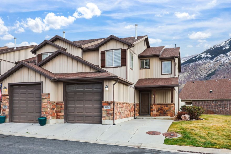 This charming 3-bedroom, 2.5-bath end-unit townhome is tucked into a peaceful North Ogden community with stunning mountain views. Its end-unit location fills the home with natural light, creating an open and welcoming atmosphere from the moment you walk in.  The kitchen features freshly updated quartz countertops and a clean, functional layout. It sits right off the dining area, which then opens into the living room for an easy, connected feel throughout the main level. Upstairs, the spacious primary bedroom is a relaxing retreat with vaulted ceilings, a private ensuite, and a walk-in closet. Two additional bedrooms and another full bath complete the upper floor, giving you flexible space for family, guests, or a home office. Outside, you'll find a small private patio area, great for enjoying a bit of outdoor space without the upkeep. A one-car garage adds extra convenience and storage. The community includes walking trails, a playground, covered picnic areas, and plenty of open green space to enjoy.  If you're looking for a light-filled, well-kept home in a quiet setting - yet still close to parks, hiking trails, shopping, and everything North Ogden has to offer, this townhome is an easy one to settle into and enjoy.