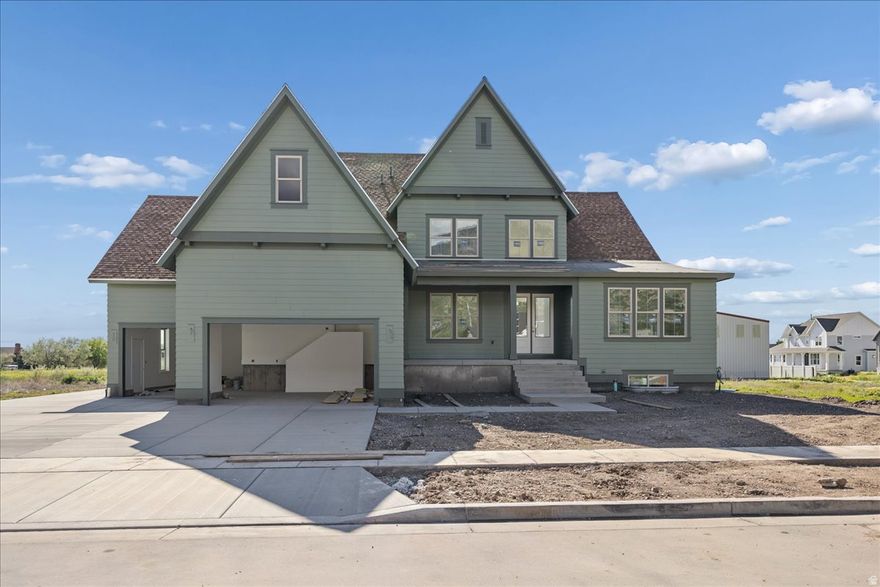 Welcome to this one-of-a-kind home in Miller Meadows, where timeless architectural character meets a thoughtfully designed, spacious layout. A welcoming covered porch opens to a dramatic two-story entry, with a formal dining room or den conveniently located just off the foyer. The heart of the home is a stunning two-story great room with soaring ceilings and a fireplace, creating an inviting space filled with natural light. The main-floor luxurious primary suite features an expansive walk-in closet with windows and a center island. The gourmet kitchen includes a large pantry, breakfast nook, and easy access to a vaulted, covered deck-perfect for entertaining. The finished basement completes the home with a giant recreation room, three bedrooms, two full bathrooms, and a large unfinished storage area, offering exceptional flexibility for guests, recreation, or future needs. Home is projected to be complete in June 2026.