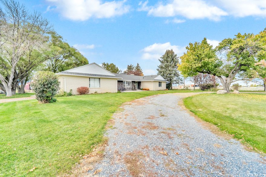 Drive down your own private lane to a beautiful home surrounded by large mature trees, green grass, and pastures. Step inside this immaculate home and be greeted by a spacious living room full of natural light. Adjacent is a beautiful kitchen with modern appliances and hardwood floors. The formal living room provides an elegant space for dining and afterwards relax in the cozy living room watching your favorite movie as a fire burns in the fireplace. The spacious master suite is on the main level showcasing a large walk in shower for a luxurious experience. An additional bedroom, versatile office space, and laundry are all conveniently located on the main level. Walk downstairs to two additional bedroom, fully finished living room, full bath, and additional space for crafts or other hobbies. Outside you will enjoy the private serene atmosphere of a fully landscaped yard from your hot tub just outside the living room. This rare property is perfect for entraining and has hosted several events including weddings.  Square footage figures are provided as a courtesy estimate only and were obtained from tax records.  Buyer is advised to obtain an independent measurement.