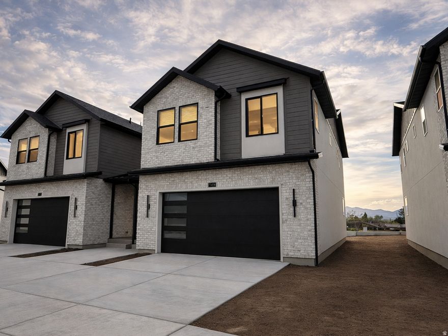 New construction at Trailside Reserve. Twin home that lives like a single family home with open great room, fireplace insert, quartz countertops, under cabinet lighting, included blinds, fully fenced backyard, EV charging port, and full unfinished basement. Brighton Traditional design package with 9' ceilings on the main level, Low E double pane windows, composite decking, 95% efficient furnace, and 7 layer sound protection. Model home open Mon-Sat 12 PM to 6 PM at 6760 S 300 E, Midvale. Virtually staged. Photos may vary by unit and may show a similar home with the same finishes.