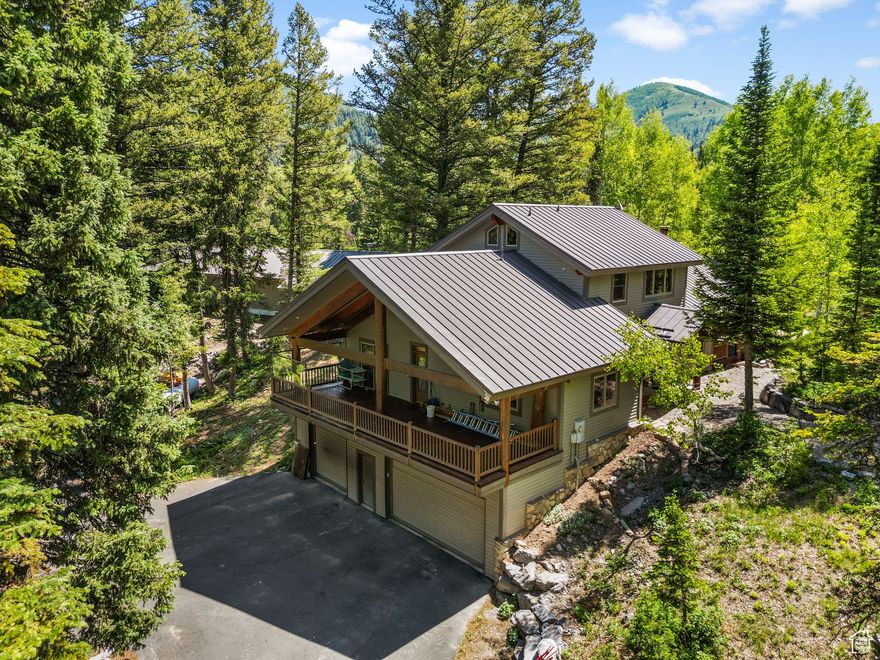 An EXRAORDINARY MOUNTAIN RETREAT, situated in the most pristine, secluded, quiet gated community in Big Cottonwood Canyon. 3.42 acres. Nick named, "BARTS PARK" borderlines the Cardiff Fork River with trail to the river, bricked firepit, volleyball court, and amazingly perfect trimmed trees, and well-maintained landscaping. Trailhead to Donut Falls, Cardiff Fork and Mt. Kessler. Easy access to summer hiking, mountain biking and back country skiing. 10 minutes to Solitude and Brighton Ski Resorts. This expansive property includes a separate 1,500 sq. ft. Dance Studio with a climbing wall, kitchen, sauna and bathroom. Additional Highlights includes an expansive covered deck living area, great for family and friend gatherings. Plenty of storage, shop and workbench in basement.  3 car garage. Buyer to verify all MLS information including square footage.