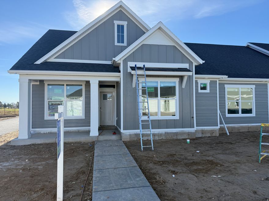 LAST home to be listed in this AMAZING community!! Almost COMPLETED & Designed for easy one-level living with 9-foot ceilings & huge windows next to the golf course. GREAT location on a dead end road with extra green space surrounding the home and panoramic views of the mountains and golf course!! The large kitchen includes upgraded stainless steel appliances, a 5-burner gas range with convection oven & air fryer, upgraded cabinets adorned with sleek hardware, backsplash, and quartz countertops. A gorgeous tiled fireplace to accent the beautiful great room. The owner's suite includes a spacious bedroom, walk-in closet, large linen closet and dual vanity. Plenty of space with the oversized 2 car garage, fenced private patio and an office as you enter the home. Enjoy community amenities such as a Pickleball court, along with hassle-free living, including yard care and snow removal. Rest assured, with builder, system & structural warranties included. AMAZING incentives $11,000+ with our preferred lender OR cash discount, ask about details. Don't delay, come see this beautiful home before it's sold!