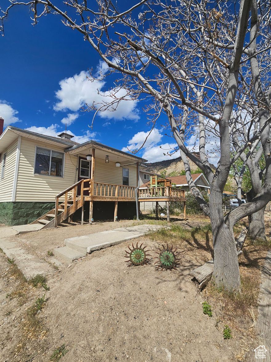 Price Reduced-Motivated Seller! Welcome to your ideal basecamp retreat in the quiet town of Kenilworth, just moments from Utah's breathtaking Book Cliffs. Whether you're searching for a cozy starter home or a relaxing weekend getaway, this move-in ready gem is not one to miss. Step inside to experience the character of beautifully restored wood floors that shine, thoughtful updates throughout, and custom finishes that make daily living feel simple and inviting. The spacious backyard and welcoming front porch offer a blank canvas where you can design a perfect desert landscape dream-whether that means stargazing, gathering with loved ones, planting a garden, or simply soaking up the peace and quiet in a uniquely special spot. Updated photos and open house details are coming soon-don't miss the chance to make this charming retreat your own!  Square footage figures are provided as a courtesy estimate only and were obtained from county records.  Buyer is advised to obtain an independent measurement.