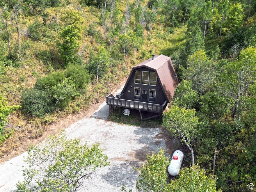 Off-Grid Cabin in Grass Creek Ranches, Coalville, UT Nestled on 51 acres in the gated Grass Creek Ranches near Coalville, this 3-bed, 1-bath cabin is ideal for hunters and off-grid enthusiasts. Recently renovated with new propane appliances, fixtures, a remodeled bathroom, a 500-gal propane tank, and an auto-start generator (62 hours). Features spring water, septic, electric baseboard heat, and a wood-burning fireplace. Moose frequent the backyard, perfect for wildlife enthusiasts. Enjoy a stocked trout pond, low HOA fees for road and amenity maintenance, and a deck and fire pit for serene evenings. Non-divisible property.