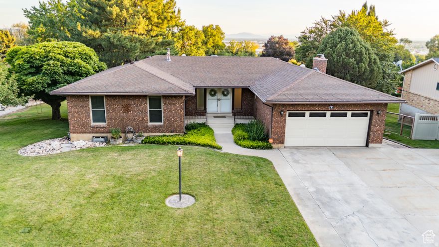 Welcome to this all brick, stunning rambler in one of Pleasant View's most desirable neighborhoods, offering breathtaking mountain and valley views. With over 3,500 square feet, this home features 6 bedrooms, 3 bathrooms, and the convenience of laundry on both levels. The completely remodelled kitchen with real cherry wood cabinets, opens to comfortable living spaces, including a formal living room with real walnut crown, perfect for entertaining or relaxing. The walk-out basement boasts a spacious family room with plenty of space where a second kitchen could easily be added-ideal for guests or potential rental income. Step outside to a large covered deck where you can entertain or simply unwind while soaking in the city views. Enjoy peace of mind with paid-off solar panels and an oversized generator, ensuring you're never without power. Sitting on over a half-acre, this property offers ample storage inside and out, giving you room to spread out and enjoy this quiet corner of Utah.