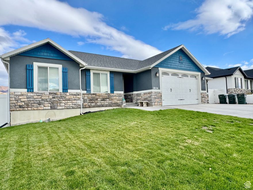 Look at this amazing home! The 9-foot ceilings throughout, especially in the garage, must make the space feel so open and airy. Custom knotty pine cabinetry-such a warm, rustic touch in both the kitchen and bathrooms. A soak-in master bathtub is the perfect spot to unwind, and a tankless water heater is such a smart, energy-efficient upgrade. The extended cement patio is a great space for outdoor gatherings, and having the basement bathroom already framed with a toilet makes finishing the basement super convenient. Plus, the drain for a kitchenette or bar in the basement is such a nice bonus for entertaining or creating a separate living area. And wow-a 4-car garage with tandem space? That's a dream for anyone with multiple vehicles or hobbies that need storage. Upgraded wooden plank flooring on the main level must add a beautiful, cohesive look throughout the living spaces. And no backyard neighbors? That's such a rare find-peace and privacy are huge pluses!