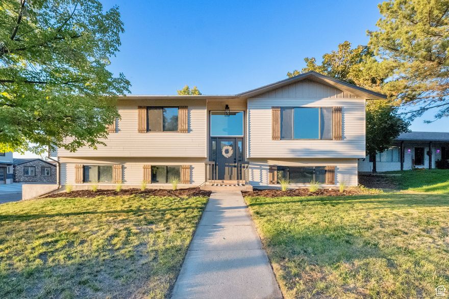 Welcome to this Beautifully Remodeled Home in Sandy! This fully updated Sandy home has been transformed from top to bottom with stylish modern finishes throughout with an open concept floor plan. Some of the updates throughout home include all-new flooring, cabinetry, countertops, tub & showers surrounds, fixtures, lighting and extra recessed lighting, new baseboards, new interior doors and front door, finished basement, and fresh paint inside and out. You'll love the beautifully designed kitchen featuring brand-new soft close cabinets, quartz countertops, stainless steel appliances (including a refrigerator), and a spacious island-ideal for gathering and entertaining.  Large double-pane windows fill the home with abundant natural light, complementing the neutral color palette. The primary bedroom offers a walk-in closet and a private bathroom. Enjoy indoor-outdoor living with a large covered deck off the kitchen and dining area-perfect for relaxing or entertaining. Outside you will find a  generous corner lot features a fully fenced backyard, ideal for play, family get togethers or pets. The property also includes a newer roof, a two-car garage with a workbench, and a backyard shed, providing plenty of space for storage or projects. There's even a dedicated RV pad, so you'll have plenty of room for extra parking or your adventure-ready recreational vehicle. Conveniently located near Fort Union's shops, restaurants, and entertainment, and just minutes from the Wasatch Mountains and nearby canyons, this beautifully remodeled home is move-in ready and waiting for you!