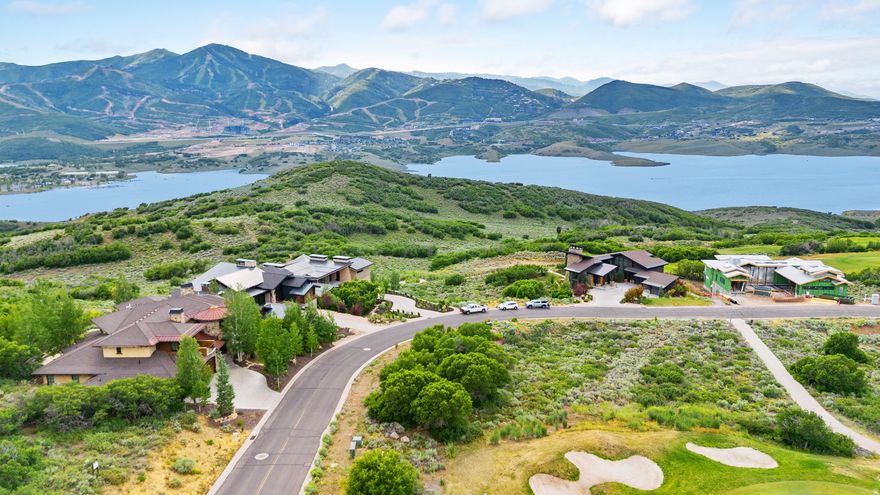 This .36-acre Hideout Canyon lot showcases unobstructed views of Mount Timpanogos, Bald Mountain, Jordanelle Reservoir, Deer Valley Resort, and the surrounding fairways. Perched above the 2nd hole of the Outlaw Golf Course, the gentle slope sets the stage for a custom home oriented toward the scenery. Just minutes to Park City's Main Street and roughly 30 minutes to the Salt Lake Valley, it blends convenience with a quiet mountain setting. With the newly completed Sunrise Gondola providing faster and more direct access up the mountain from Canyons Village, along with the upcoming 2034 Winter Olympics bringing renewed focus to the region, both convenience and long-term demand continue to rise. Schematic plans are in hand, thoughtfully designed to frame the views from every room, creating an exceptional opportunity for a primary residence, second home, or long-term investment in a luxury mountain community.