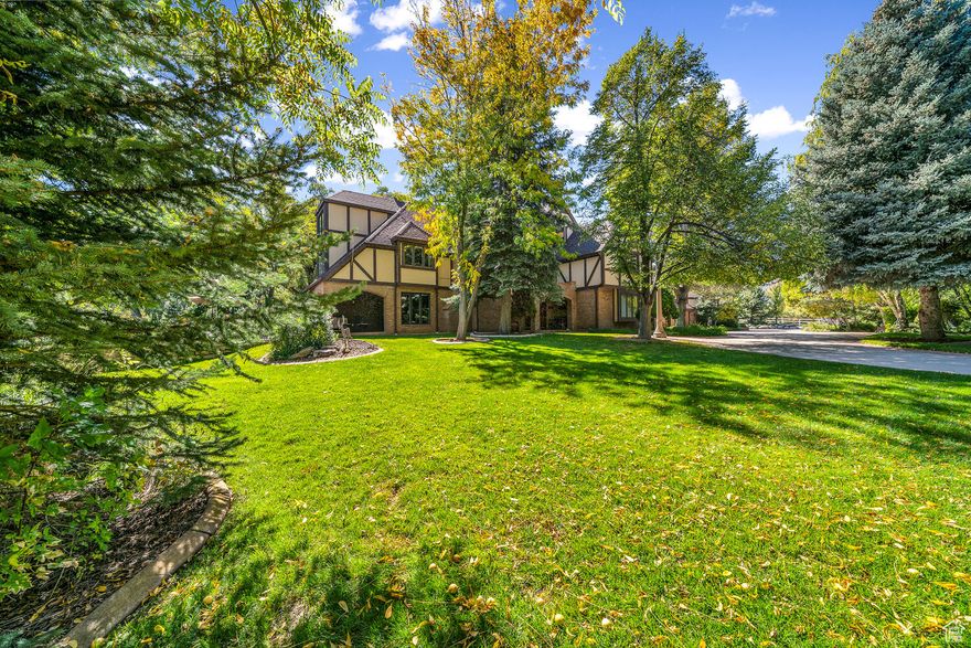 A rare opportunity to own a private 3-acre estate near Zion, designed for unforgettable experiences and limitless potential. Tucked inside Deer Hollow behind a gated, tree-lined drive, this enchanting Tudor-style home features 11 themed bedrooms, three full kitchens, and space that adapts to your lifestyle-whether that's a peaceful family retreat, luxury short-term rental, or boutique event venue.  The west wing currently operates as a successful Airbnb with a separate 3 bed, 3 bath suite. A sunroom overlooks a stocked freshwater pond and dock, while the property also includes a garden kitchen, orchard, greenhouse, and shared well water-perfect for farm-to-table events or self-sufficient living.  Additional 7 acres are available for purchase, featuring a 2-bedroom guest house, spacious shop, and room to expand your vision into a vineyard, artist's retreat, or wellness center. Located just across from Kolob Canyons (Zion National Park), near Brian Head Ski Resort and Cedar Breaks, and only 30 minutes to flights from Cedar City or St. George.  Whether you're seeking a legacy property, income opportunity, or serene escape, this estate delivers. Private, magical, and built for something extraordinary.