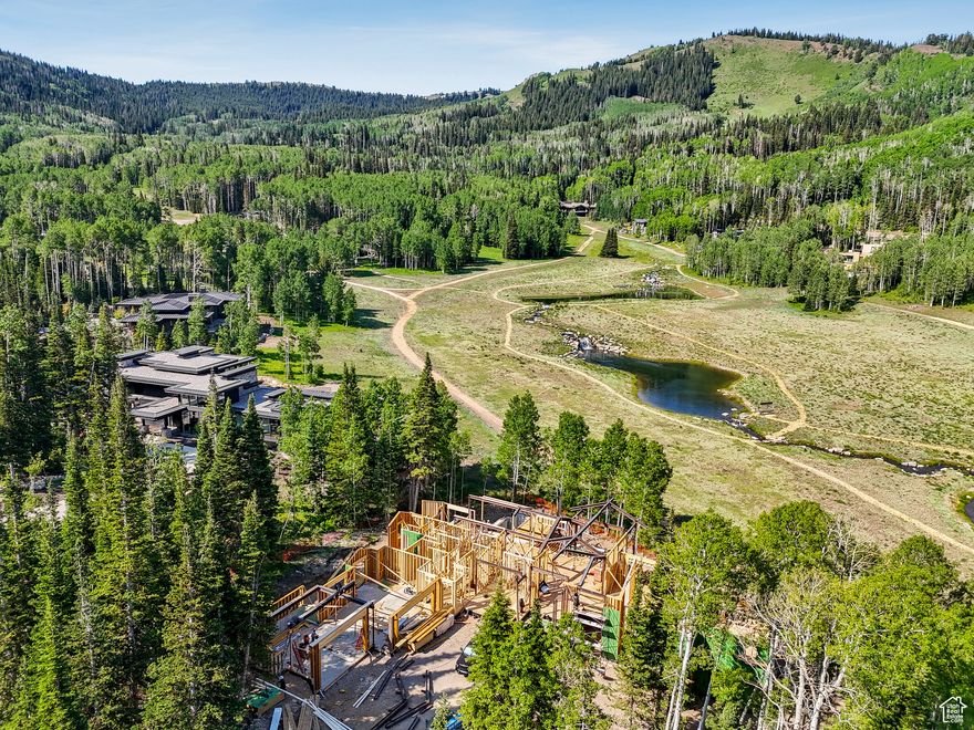 This private custom ski-in/ski-out home is currently under construction nestled within The Colony at White Pine Canyon, an exclusive guard-gated residential neighborhood consisting of large acreage lots with direct ski and snowboard access to the Nation's Largest Ski Resort. The legacy ski resort home of your dreams, this floor plan spans over 11,600 sq ft and promises the perfect mix of comfort and luxury with plenty of indoor and outdoor living areas for unparalleled enjoyment and ample space for hosting and entertaining family and friends. Surrounded by natural beauty, this residence is a haven amidst the trees, offering breathtaking views of the mountains and ski runs as well as the enchanting ponds, all visible from the comfort of your luxurious retreat.   The Colony is located just 5 minutes from Canyons Village Base Area, 15 minutes to Park City's historic Main Street for shopping & dining, 30 minutes from blue ribbon fly fishing on the Provo River, 40 minutes to the private Heber Airport, and 50 minutes to the Salt Lake Airport. Located within 4,600 acres of pristine high alpine terrain, The Colony has approximately 90% of its landscape preserved as open space. In warmer months there are over 400 miles of single track trails throughout the surrounding area easily accessed by the 26-mile single track Mid-Mountain Trail running directly through The Colony. Embrace the lifestyle you've always dreamt of in this mountain sanctuary.