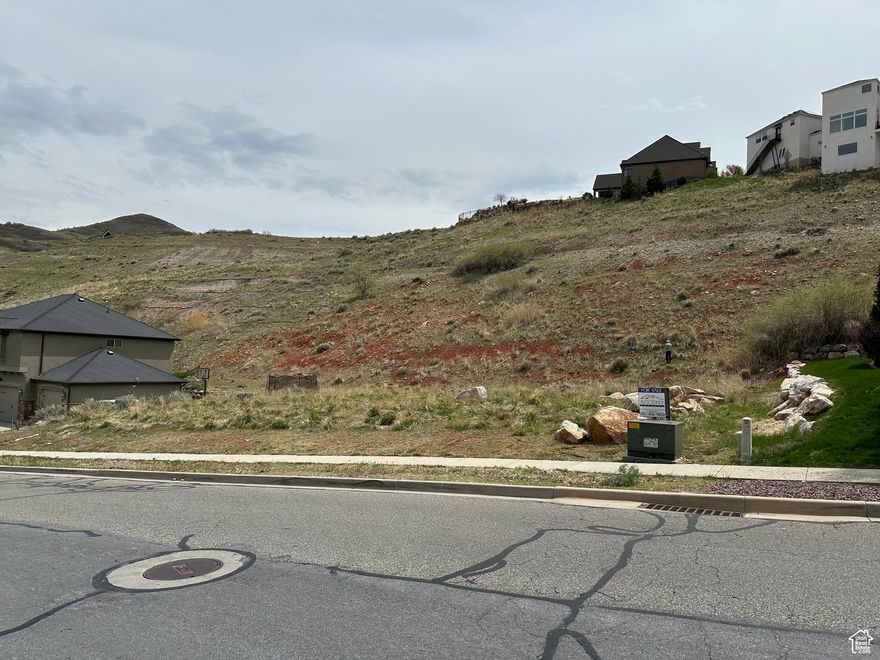 Looking to build your dream home? Don't miss this rare opportunity to own a premium lot with breathtaking views and an unbeatable location! With a stunning view of the Great Salt Lake and Wasatch Mountains this lot offers the perfect balance of tranquility, accessibility, and value to build your new custom home. Just 10 minutes to downtown Salt Lake City, 5 minutes to the I-15 freeway, and is located only three doors down from the Eagle Ridge Tennis & Swim Club! Build ready with easy access to utilities and a quiet, established neighborhood. Lots like this are hard to find!