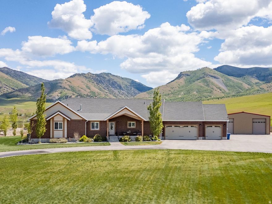Tucked away on a private road, this custom-built, 4-bedroom, 3.5-bath home is situated on 2.76 serene acres with sweeping mountain views. The versatile, open floor plan is designed for modern living, featuring oversized bedrooms and expansive spaces throughout. The basement includes two generous flex spaces ideal for a home gym and year-round entertaining. The spacious kitchen boasts abundant cabinetry, a huge walk-in pantry, a large kitchen island with seating, and a dedicated dining space. For added comfort, a whole-house water filtration system and a reverse osmosis filter in kitchen ensure pure water throughout the home. Outside, the property features a 40-by-60 steel workshop with power offering endless possibilities. Come see this exceptional property!  Buyer to verify all information.