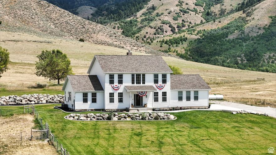 Gorgeous home located in the highly sought-after New Canyon area, just minutes north of Malad, Idaho. Set on 4.6 acres with panoramic mountain and valley views, this property offers the perfect blend of privacy and convenience-just a short drive to I-15. Built in 2021, the spacious two-story home features 3,500 sq ft, 4 bedrooms, and 5 bathrooms, with the potential to convert to 6 bedrooms by adding closets. Ideal for remote work with fiber internet and CAT-6 ethernet throughout. The vaulted entry opens to a large living room with a cozy fireplace and flows into a stunning gourmet kitchen with an oversized island, premium range, wood-burning stove, two dishwashers, and expansive picture windows. Two laundry hookups, including one in the primary suite walk-in closet, add function and ease. The outdoor space is equally impressive-fully landscaped with water spigots and power run to the large shed and fenced area that has the two white and black chicken coops. Additional upgrades include tankless water heater, kitchen sink water purifier, remote-controlled roller shades, and included refrigerator, barn, and chicken coop-ready for animals or livestock. Why wait to build when you can own a move-in-ready, nearly new home in one of Malad's most scenic locations? Buyer to verify all information.