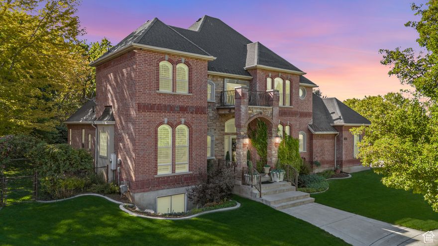 OPEN HOUSE SATURDAY 10/11/25 FROM 12-2 PM!!!  Step into timeless elegance and modern comfort in this beautifully refined home where no detail has been overlooked. From the grand two-story entry and striking staircase to the light-filled great room with custom built-in shelving, every space was designed with care and craftsmanship. The open layout flows naturally into a formal dining area, ideal for gatherings and holidays and a chef's kitchen featuring granite counters, stainless appliances, a warming drawer, and a wine cooler. Enjoy cozy evenings by the family room fireplace or step outside to your private oasis with a natural   year-round stream, lush perennials, and mature trees that frame a serene backdrop. The covered patio and heated driveway make the home enjoyable in every season. The lower level offers a thoughtfully designed second living area with its own entrance, and a second kitchen in the daylight walk out basement perfect for guests, extended family, or potential rental income. Notable updates include fresh paint, shiplap accents, LED lighting, a new electrical panel, new Wi-Fi-enabled sprinkler system, and main-level radiant heated floors. Located just minutes from Hill Air Force Base, Snowbasin and Powder Mountain ski resorts, Highway 89, and local shopping, this home truly blends comfort, sophistication, and convenience. A rare find where every feature adds to the feeling of "home!"