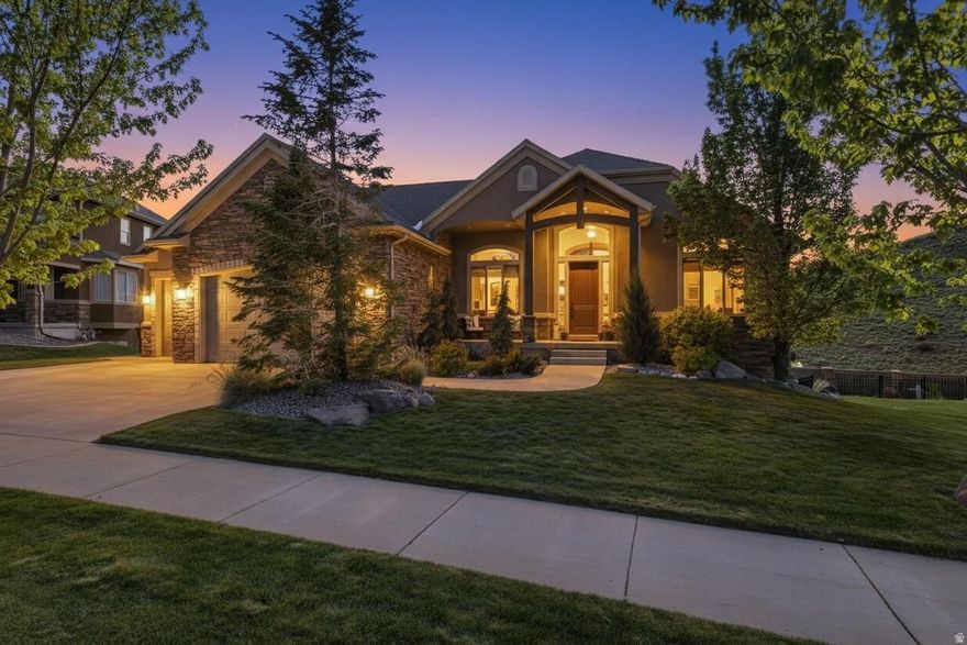 Perched high in Suncrest, this custom Draper home captures sweeping panoramic views that redefine everyday living. Thoughtfully designed for both comfort and impact, this beautifully updated five-bedroom, four bathroom residence offers a rare combination of space, light, and setting. The Main-Floor Primary Bedroom Suite features floor-to-ceiling windows that frame the surrounding landscape, a large attached walk-in closet, and an ensuite bathroom with separate tub and shower-creating a private retreat with both function and style. Enjoy views with breakfast each morning, then transition to the lovely deck in the evening-perfectly positioned for watching unforgettable sunsets stretch across the valley. Recent updates, including new flooring and appliances, enhance the home's modern appeal while maintaining its custom character. The fully finished walkout basement is designed for entertaining and everyday enjoyment, opening to a large backyard sitting area with an above-ground spa. This level features a spacious game room, television lounge, entertainment bar area, and a flex space currently used as a home gym, along with a pool table (included in the sale), creating a versatile space for gathering and relaxation. Residents of Suncrest enjoy access to exceptional HOA amenities: a resort-style pool with lazy river, water slide, and kids' area, as well as tennis courts, pickleball courts, basketball hoops, and a community library-adding to the lifestyle appeal this home offers. With its combination of custom construction, meaningful updates, and truly exceptional views, this home offers a rare opportunity to own a standout property in the Draper market-where everyday living is defined by comfort, connection, and an extraordinary setting.