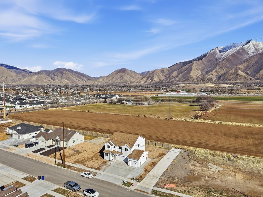 This rare homesite offers the opportunity to build in one of the area's most peaceful and prestigious neighborhoods, surrounded by breathtaking mountain views and located near Maple Mountain High School. With no HOA, no restrictive CCRs, and the freedom to design the home you truly want, opportunities like this are becoming increasingly hard to find. For buyers seeking something exceptional, R5 Homes offers the ability to create a beautifully engineered semi-custom home designed for modern living - including private family suites, multigenerational flexibility, and optional income-producing ADU living spaces. By building with the seller's preferred builder, buyers may realize substantial savings while owning a uniquely designed, high-quality home built for both lifestyle and long-term value. Contact the listing agent for full details and to explore how to maximize the potential of this exceptional property. Ask about the price of the lot if you chose a different builder.