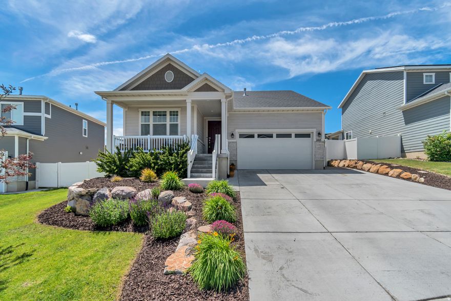 Charming single-level home in the desirable Wildflower community of Saratoga Springs! This well-maintained 5-year-old home offers efficient living with an open-concept layout, quartz countertops, large island, and cozy gas fireplace. The primary suite features a walk-in closet and frameless glass shower. Enjoy mountain and lake views from the covered front porch or relax on the extended back deck. Community amenities include trails, parks, and exclusive access to a private reservoir for swimming and paddle boarding.