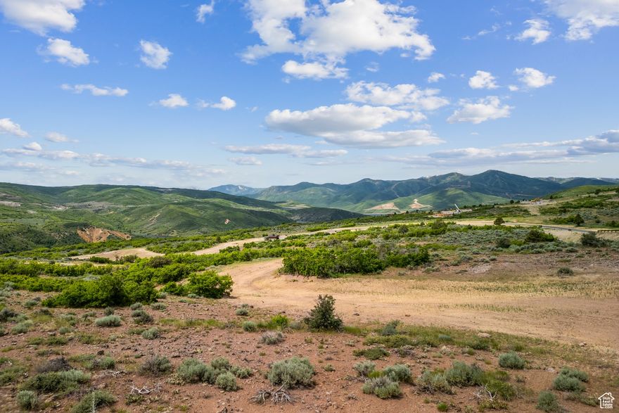 Nestled in the sought-after Cougar Moon neighborhood of Tuhaye, this stunning homesite boasts sweeping panoramic views in every direction. The primary western view corridor captures the iconic Deer Valley Ski Area and the majestic Wasatch Back mountains. To the east, take in the serene Uinta Mountains, while Coyote Ridge creates a dramatic backdrop to the south. The lot features a flat building site, providing an ideal and straightforward foundation for your dream mountain home. As part of the exclusive Talisker Club, owners enjoy world-class amenities including championship golf, exceptional dining, pools, fitness, spa services, and on-mountain access and concierge services at Deer Valley. The $200,000 Talisker Club membership deposit is included in the purchase price, offering immediate access to a lifestyle unlike any other.