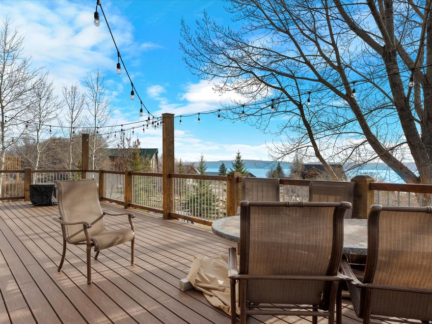 Come see this well maintained charming cabin! This property features secluded yard with mature trees, mountain and lake  views,  low maintenance exterior, and beautiful wood work inside . Conveniently located near ATV and hiking trails and just minutes away from beaches and State Marina.