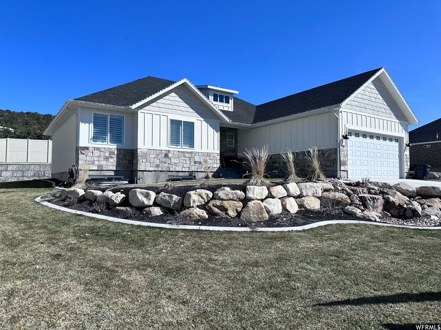 MORE PICTURES AND VIDEO COMING SOON! This home offers exceptional space, functionality, and thoughtful design throughout. Upon entry, you're welcomed by an open floor plan with vaulted ceilings, creating a bright and inviting atmosphere. The main living area features beautiful LVP flooring and flows seamlessly into a stunning kitchen complete with a large pantry-perfect for everyday living and entertaining. The primary suite includes a newly remodeled bathroom, offering updated finishes and a fresh, modern feel. The fully finished, custom basement significantly expands the living space, offering an additional four bedrooms and one bathroom, for a total of seven bedrooms and three bathrooms. The lower level also includes a spacious game room/family room, dedicated toy room, and a second laundry area for added convenience. Outside, the property is beautifully landscaped with a backyard designed for enjoyment, featuring a large patio area, an attractive block retaining wall, and a 8-foot privacy fence. A standout feature is the 1,000 sq ft shop, designed to match the home, offering two garage doors for additional parking, workspace, and abundant storage.  Square footage figures are provided as a courtesy estimate only and were obtained from seller records. Buyer is advised to obtain an independent measurement.