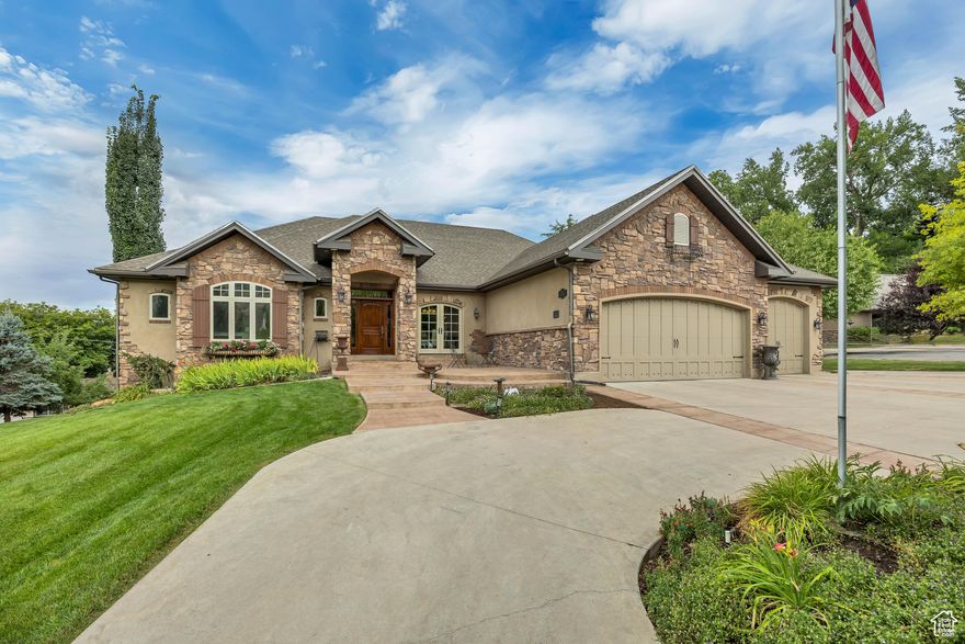 Available for Immediate Move-In.  This is not just another house on the market - it's the only one of its kind!  Tucked away in a quiet cul-de-sac with many mature trees, this home is surrounded by spectacular mountain and valley views and two neighborhood parks just steps from the front yard.  Located minutes from USU, shopping, hospital, Space Dynamics Lab, and more.  Offering over 2,500 sq. ft. of main-floor living, it is the perfect blend of privacy, tranquility and convenience.   From the custom-milled solid alder doors and moldings to the hand-distressed wood beams and stone fireplace wall, every detail speaks of quality. Real hardwood floors, travertine tile, and soaring 9- and 10-foot ceilings create a warm, open feel, while a custom iron stairway railing adds unique architectural detail. The gourmet kitchen is truly the heart of the home and features a one-of-a-kind 9-foot mahogany island countertop. With three dining areas, this home was designed for hosting and everyday living alike.  The basement family room is perfect for movie nights with surround sound wiring plus a second kitchen with built-in microwave and dishwasher. Behind the beauty lies performance and comfort: hot water in-floor heat with a gas furnace backup, premium blown-in wet insulation, soft water plumbing, and wiring for an emergency generator with on/off switch.  This home truly has too many custom features to list - no expense was spared in its design and construction. If you're looking for a home that combines timeless craftsmanship, thoughtful details, and a location that's second to none, this is it. Schedule your private tour today and experience this extraordinary home for yourself!